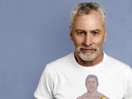 A muscular gray-haired man taking a selfie