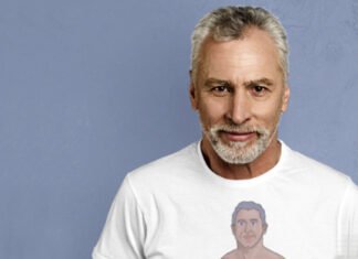 A muscular gray-haired man taking a selfie