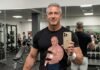 A bodybuilder daddy training with dumbbells